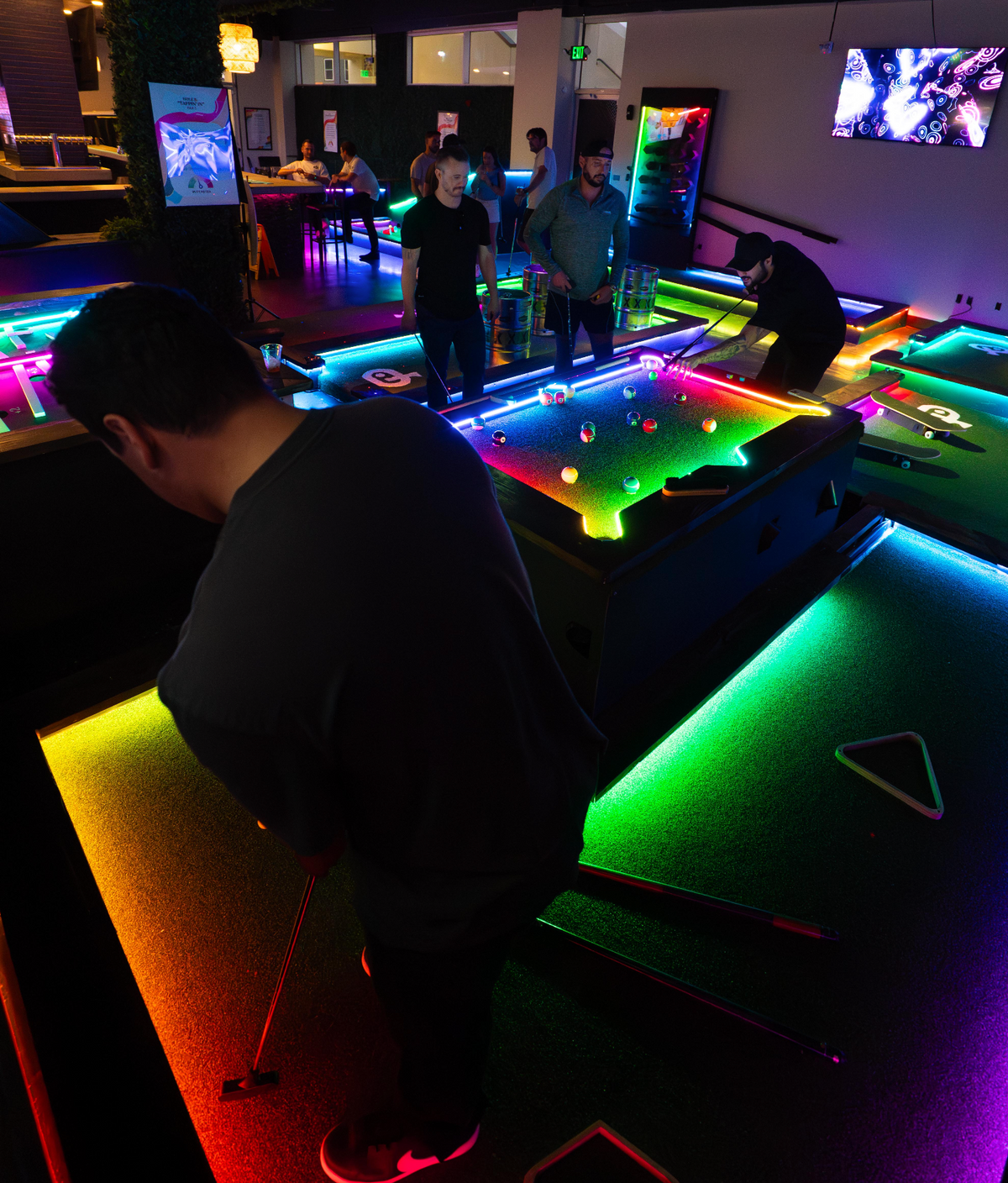 Family-friendly indoor mini golf at Playground Huntington Beach