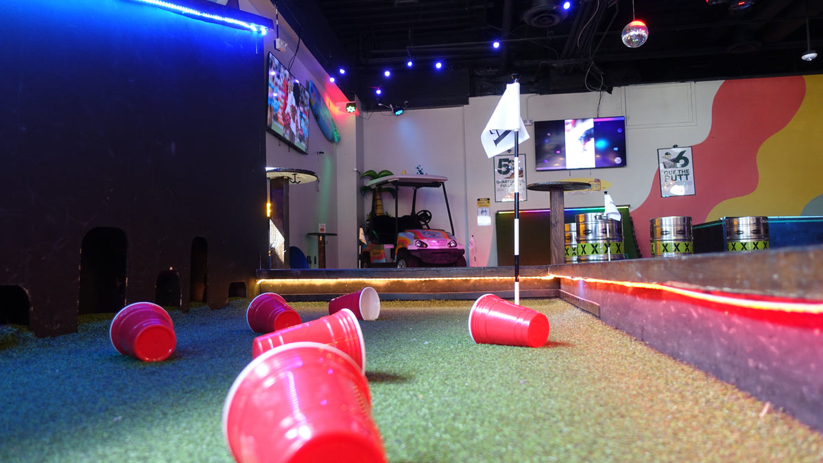Colorful indoor mini golf course at Playground Huntington Beach
